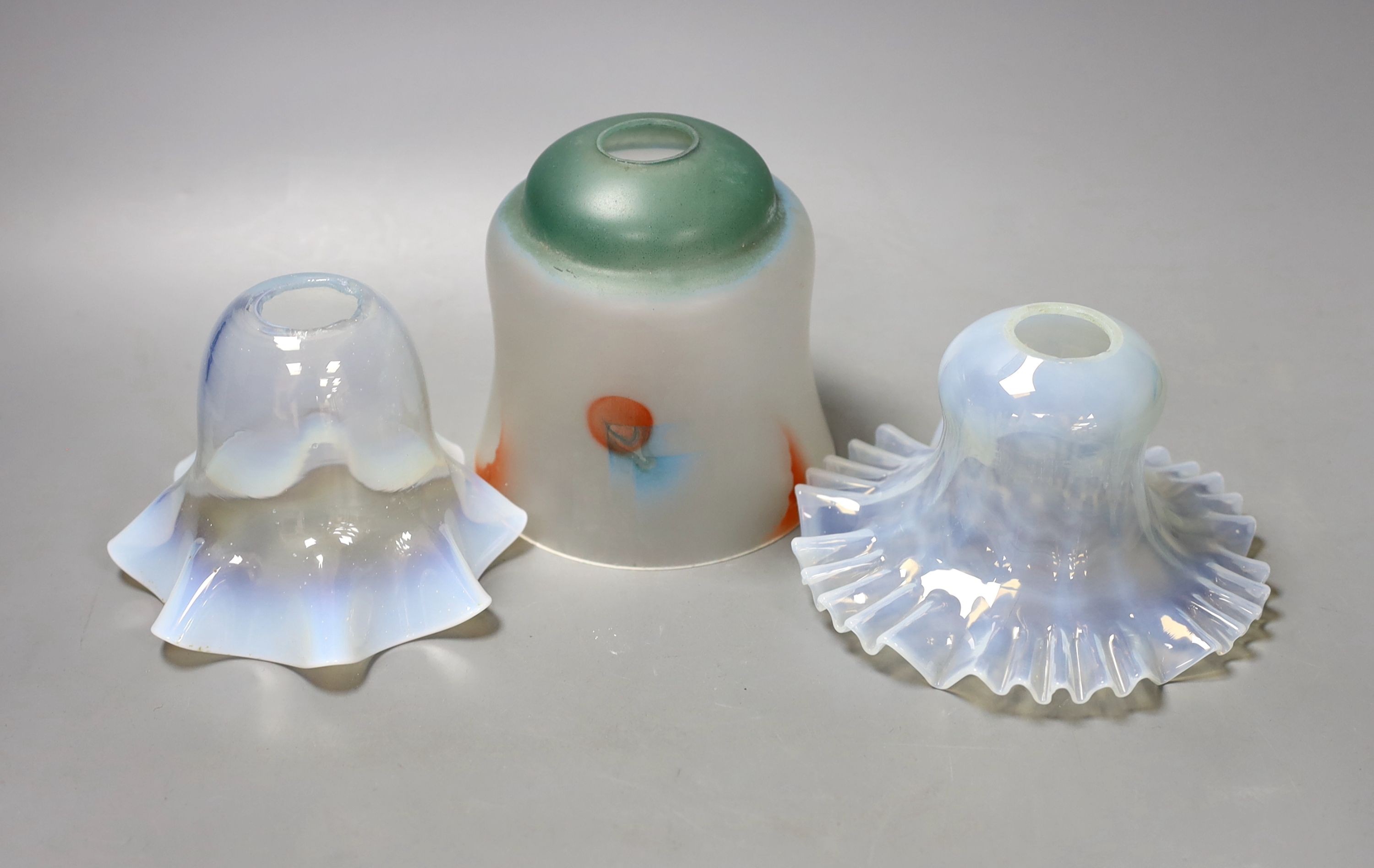 A pair of opalescent glass light shades, and a coloured light shade